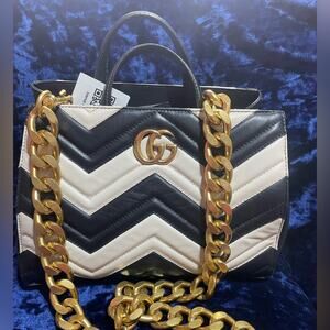 Elegant Gucci Marmot Black and Cream Handbag with Gold Chain